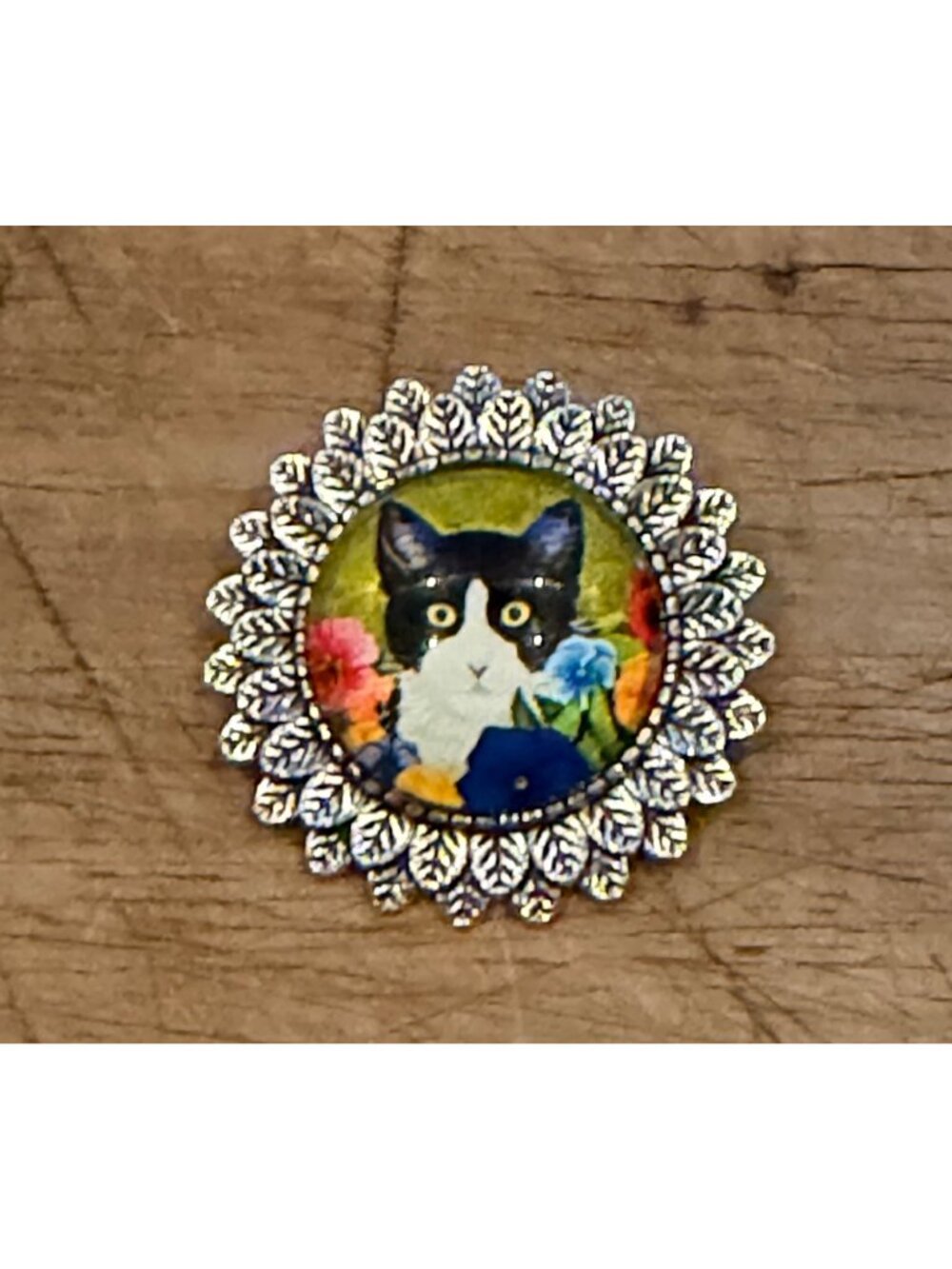 Cat-Themed Decorative Brooch With Floral Design & Silver Leaf Frame